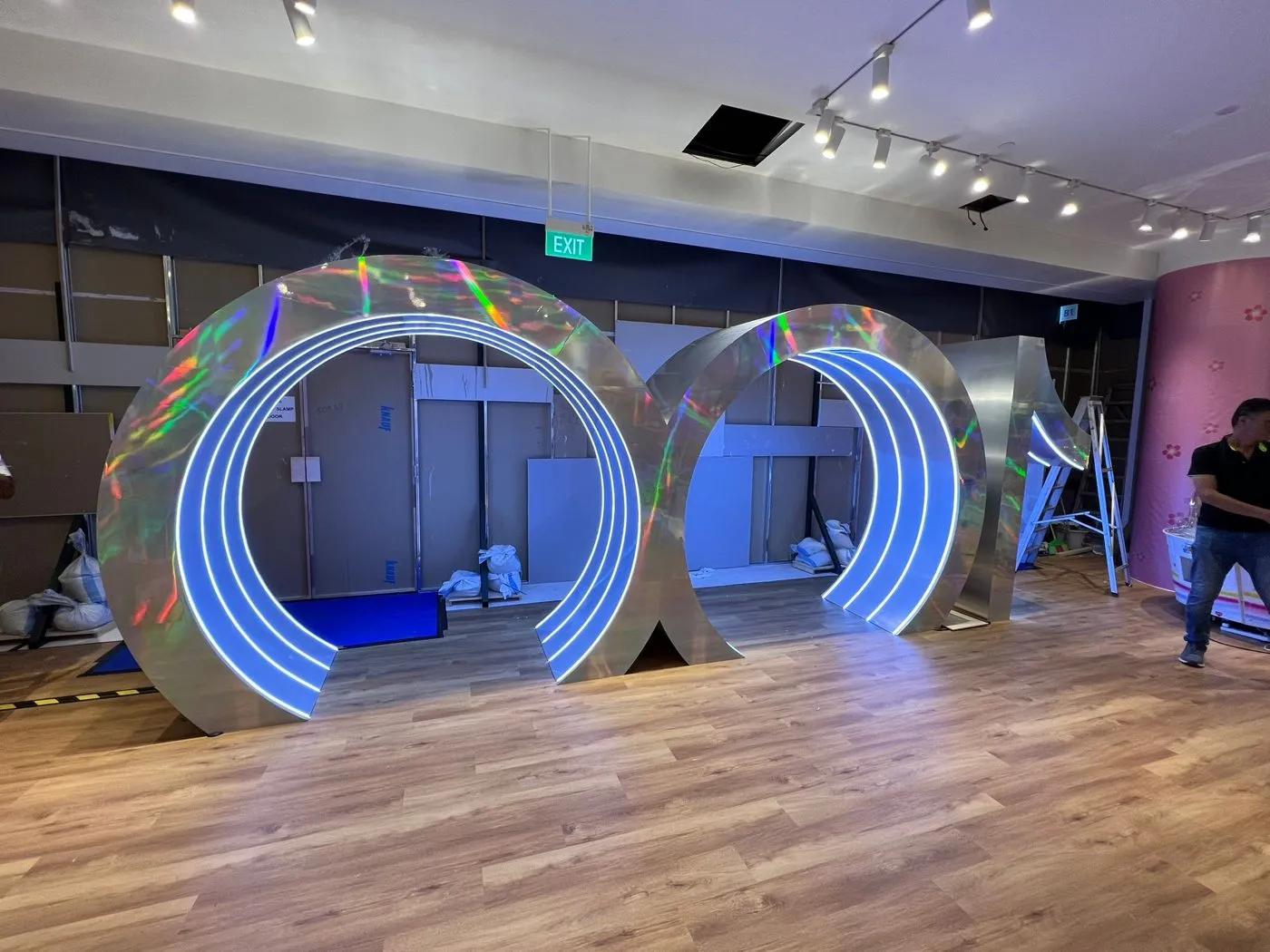Sculptural LED ring arches at an event