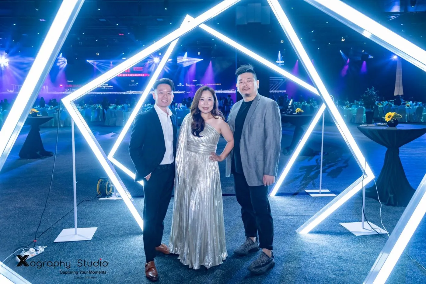 An LED pentagon photo gate at an evening event